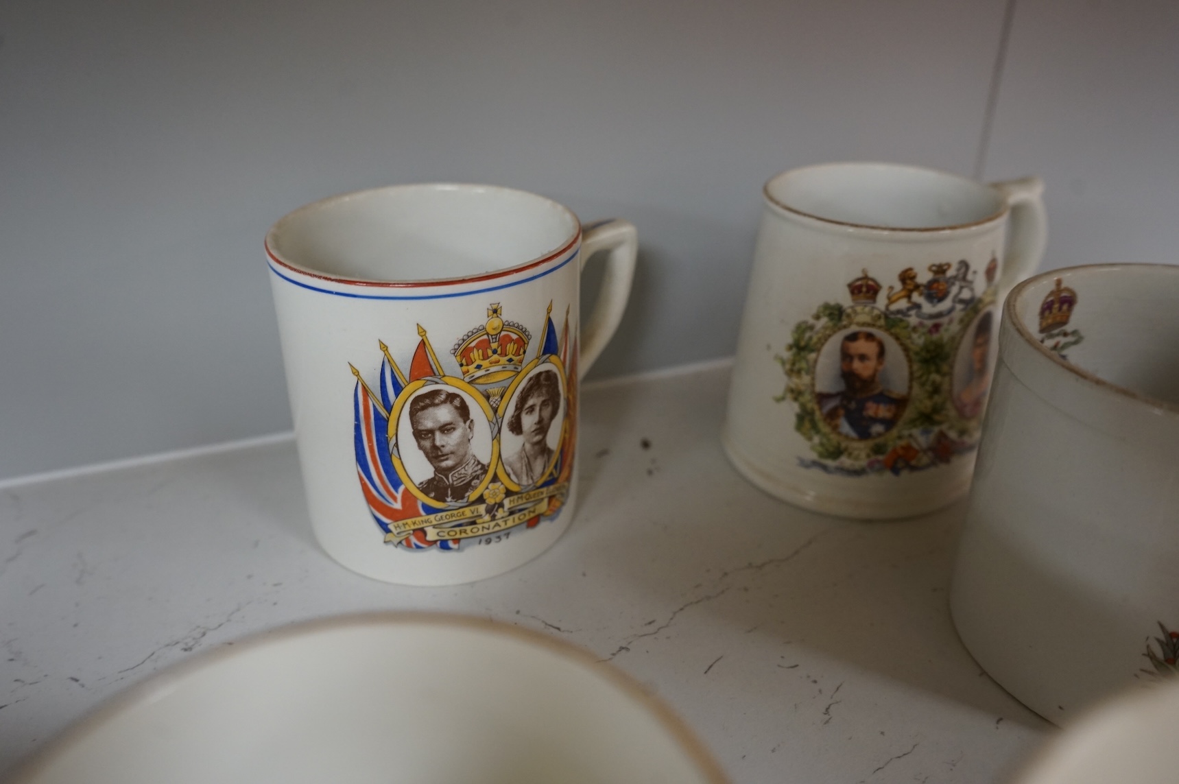A lithophane commemorative mug and ten others to include George VI and Elizabeth coronation 1937, largest 9.5cm high